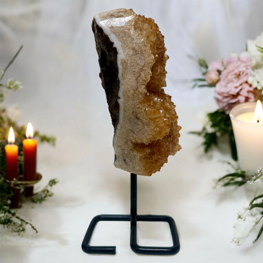 Golden Citrine Crystal Geode Displayed on a metal stand